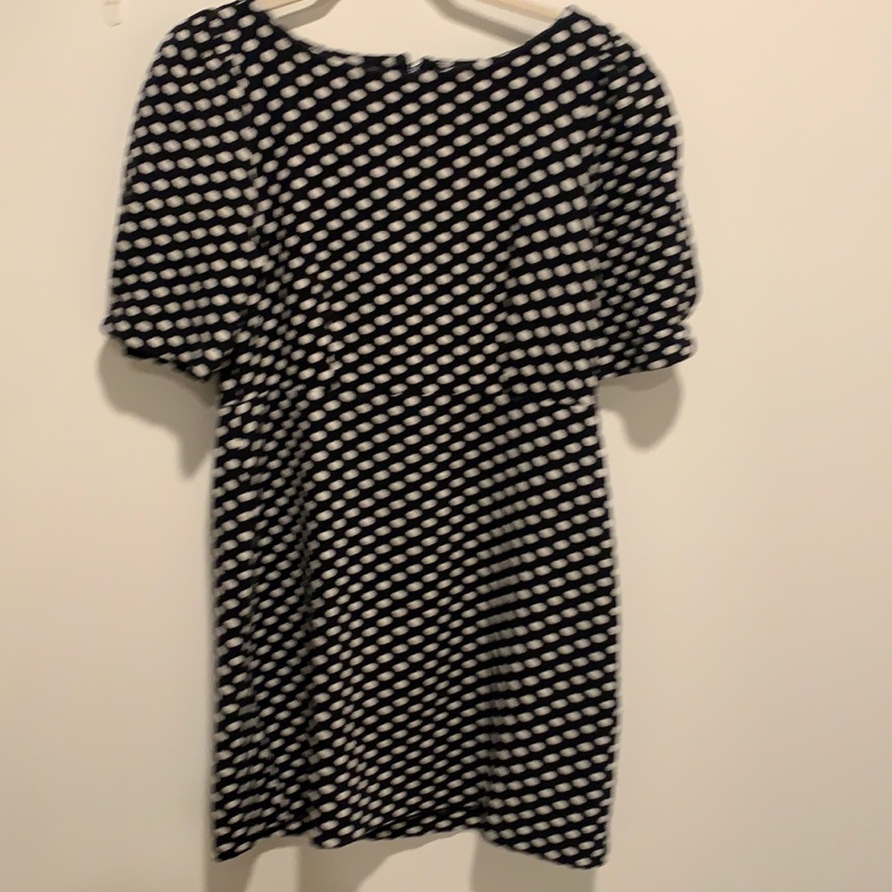 Washable, a little on shorter side hits above knee. Nice weight knit